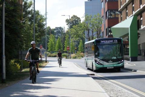 Bus in Bracknell with cyclists on path